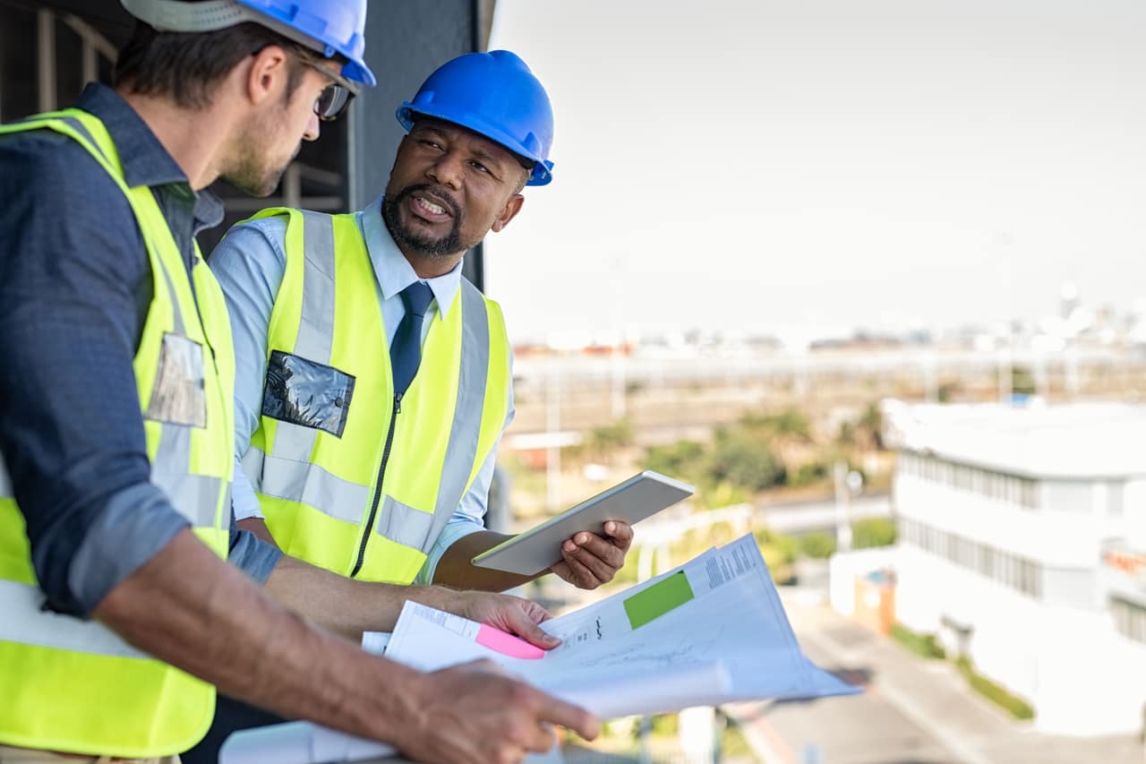 UBIC team member reviewing a safety plan with an employer